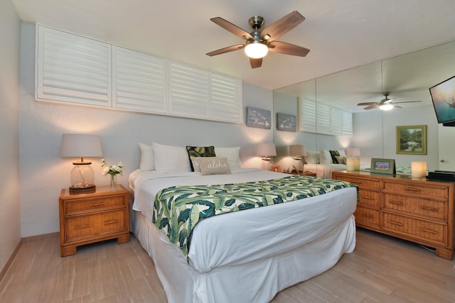 bedroom featuring light hardwood / wood-style floors and ceiling fan