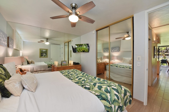 bedroom featuring ceiling fan and hardwood / wood-style flooring