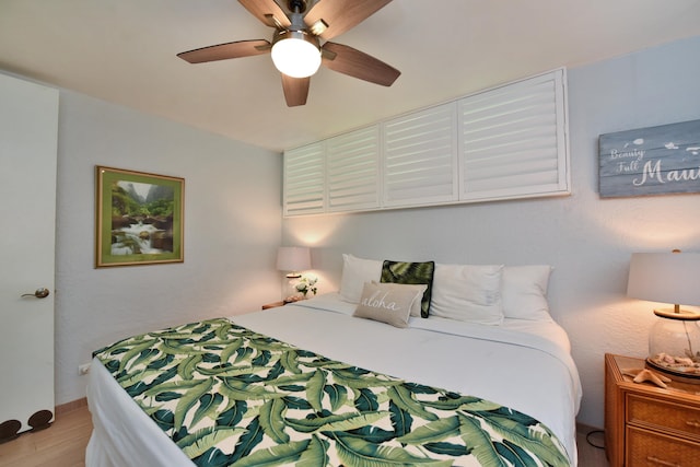 bedroom featuring ceiling fan and hardwood / wood-style flooring