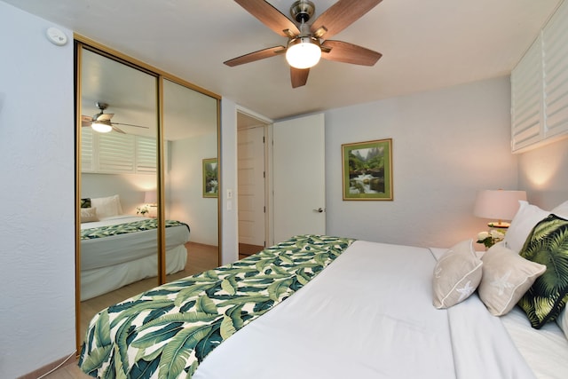 bedroom with a closet, ceiling fan, and light wood-type flooring