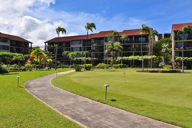 view of home's community featuring a lawn