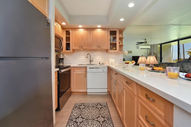 kitchen featuring refrigerator, electric range, light brown cabinets, light wood-type flooring, and white dishwasher