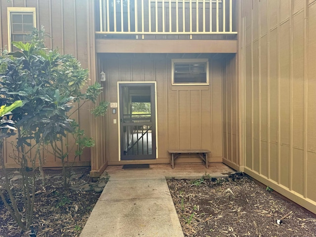 entrance to property with a balcony