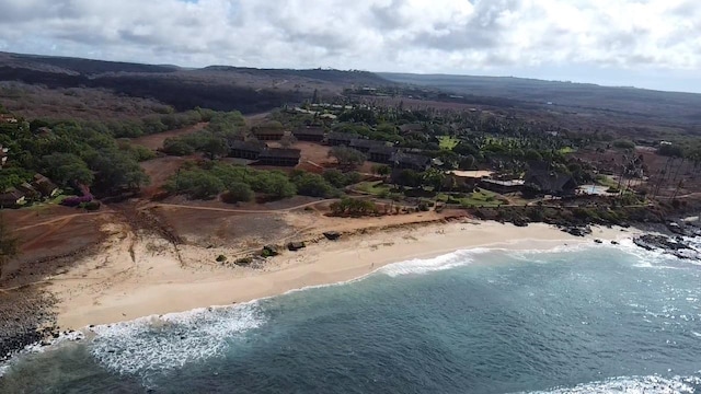 aerial view featuring a water view and a view of the beach