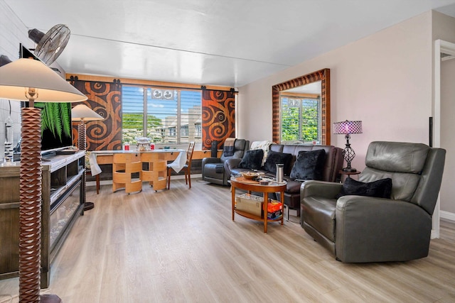 living area featuring wood finished floors and baseboards