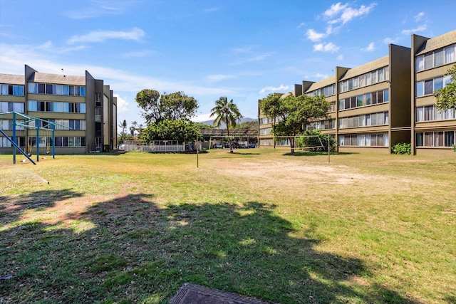 view of home's community featuring a lawn