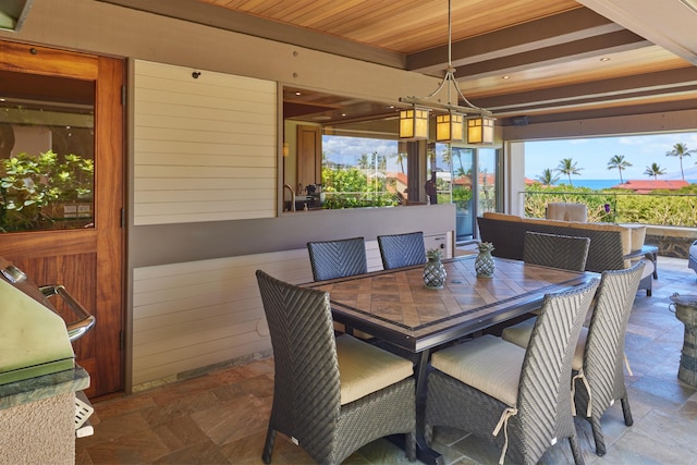 4000 Wailea Alanui Dr Unit 901, Kihei, HI 96753 - dining room with stone tile flooring and a chandelier