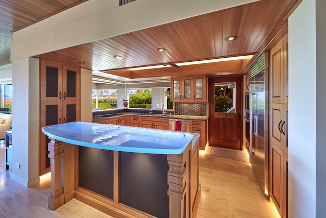 4000 Wailea Alanui Dr Unit 901, Kihei, HI 96753 - kitchen featuring wooden ceiling, stainless steel appliances, recessed lighting, glass insert cabinets, and brown cabinetry