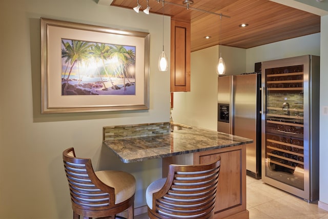 4000 Wailea Alanui Dr Unit 901, Kihei, HI 96753 - kitchen with stainless steel refrigerator with ice dispenser, wine cooler, wood ceiling, dark stone counters, and a peninsula