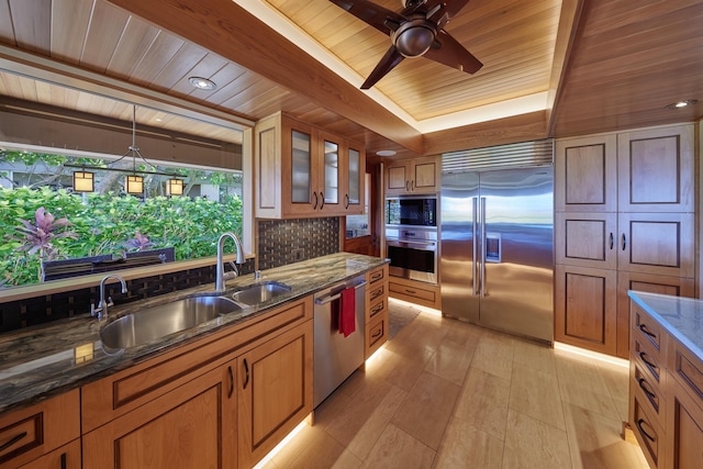 4000 Wailea Alanui Dr Unit 901, Kihei, HI 96753 - kitchen featuring built in appliances, wood ceiling, brown cabinetry, and a ceiling fan