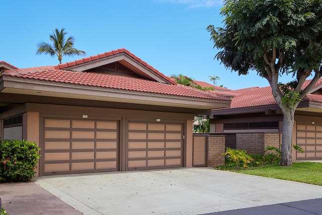 4000 Wailea Alanui Dr Unit 901, Kihei, HI 96753 - view of front of home featuring a tile roof, stucco siding, and a garage