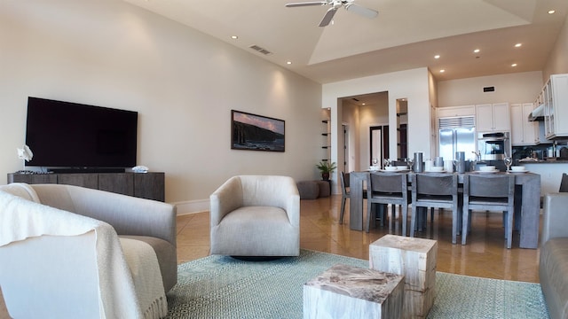 living room with high vaulted ceiling, a ceiling fan, visible vents, and light tile patterned flooring