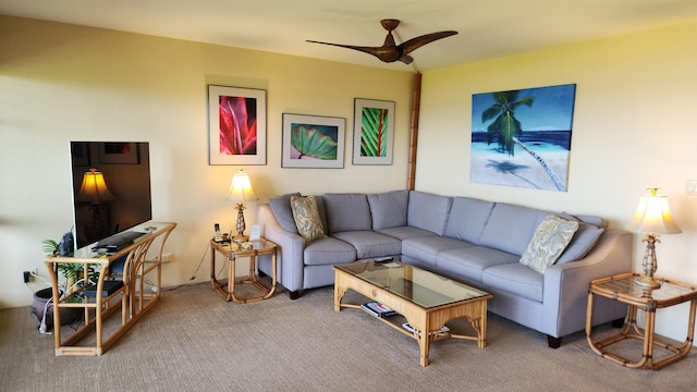 carpeted living area with ceiling fan