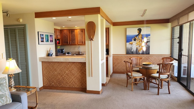 dining space featuring recessed lighting and light colored carpet