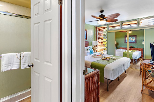 bedroom featuring hardwood / wood-style flooring and ceiling fan