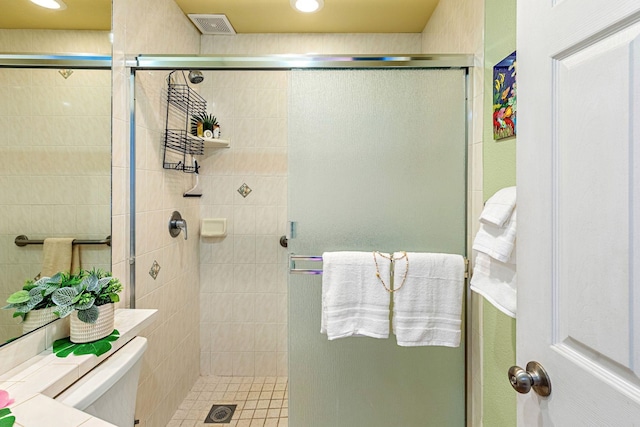 bathroom featuring a shower with door