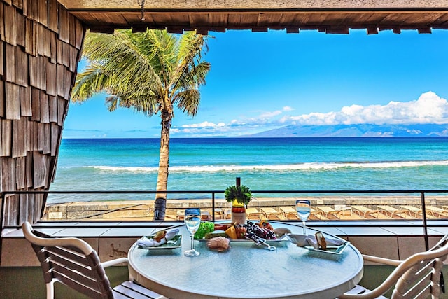 balcony with a water and mountain view