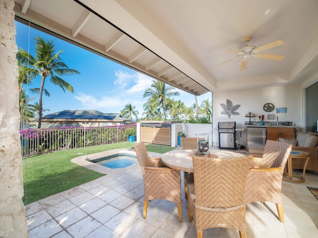 view of patio / terrace with sink, ceiling fan, and a grill