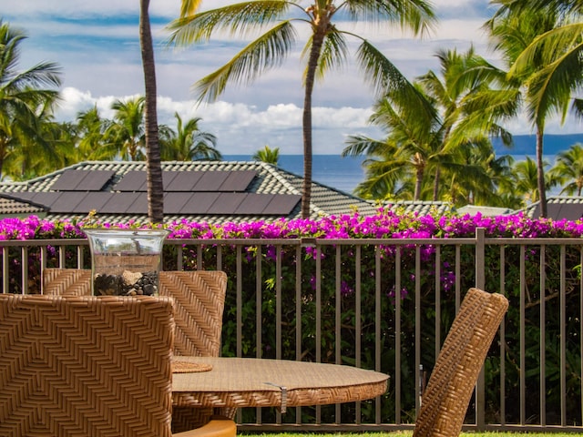 balcony featuring a water view