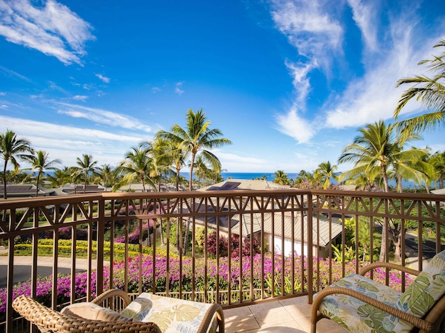 balcony featuring a water view