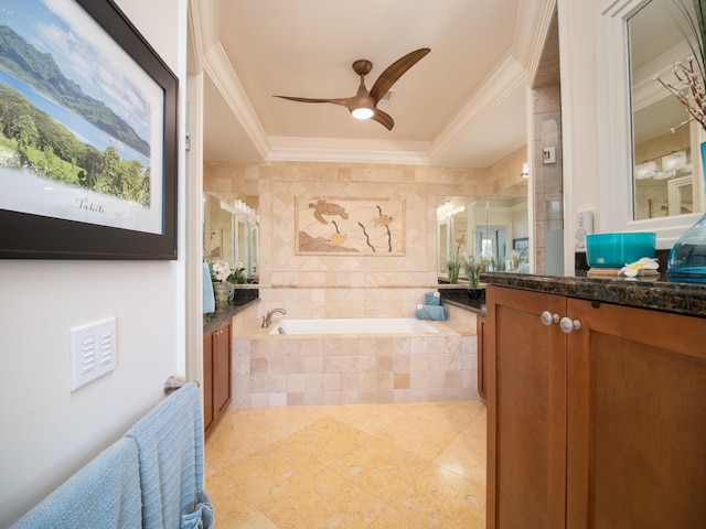 bathroom featuring vanity, ceiling fan, crown molding, and tiled tub