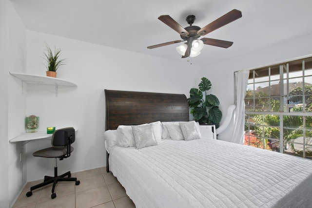 bedroom featuring light tile patterned floors and ceiling fan