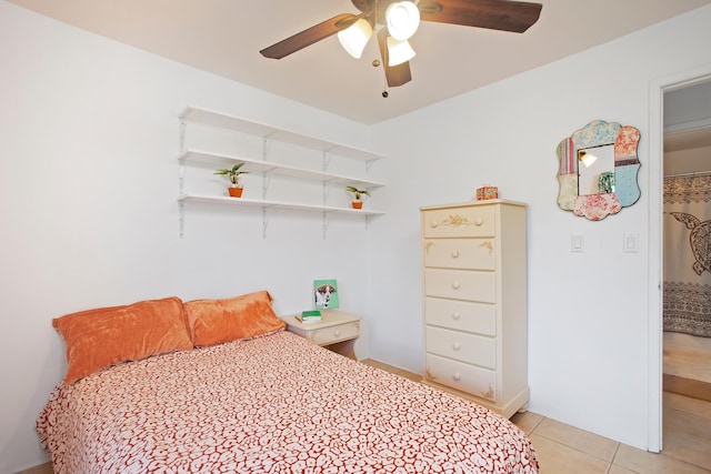 bedroom with ceiling fan and light tile patterned flooring