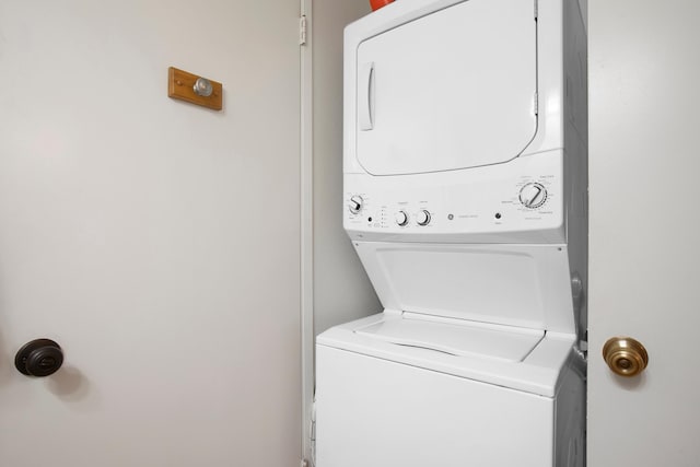 laundry room featuring stacked washer and clothes dryer