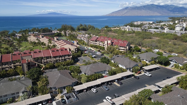 aerial view featuring a water and mountain view