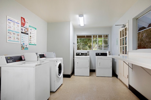 clothes washing area featuring washing machine and dryer