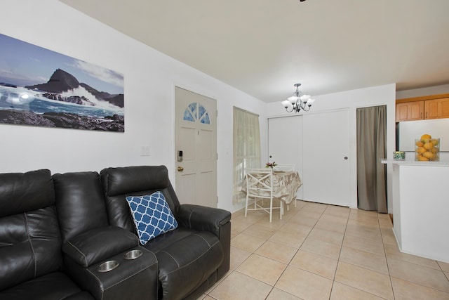 living room with light tile patterned flooring and a notable chandelier