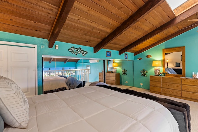 bedroom featuring wood ceiling, vaulted ceiling with skylight, and a closet