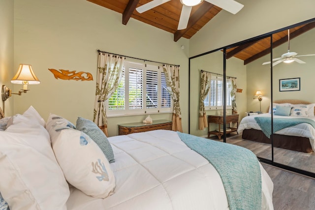 bedroom featuring hardwood / wood-style floors, ceiling fan, a closet, wood ceiling, and beam ceiling