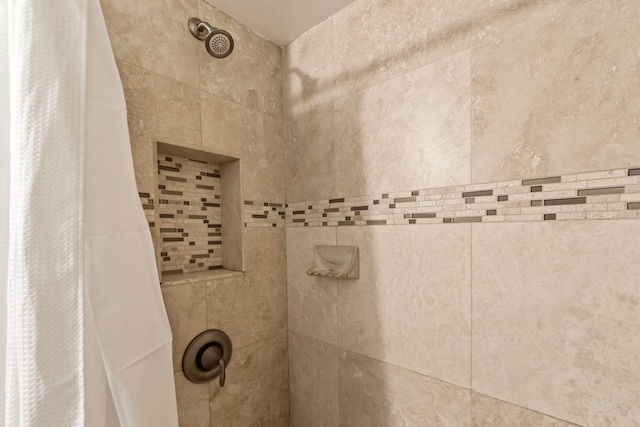 bathroom featuring curtained shower