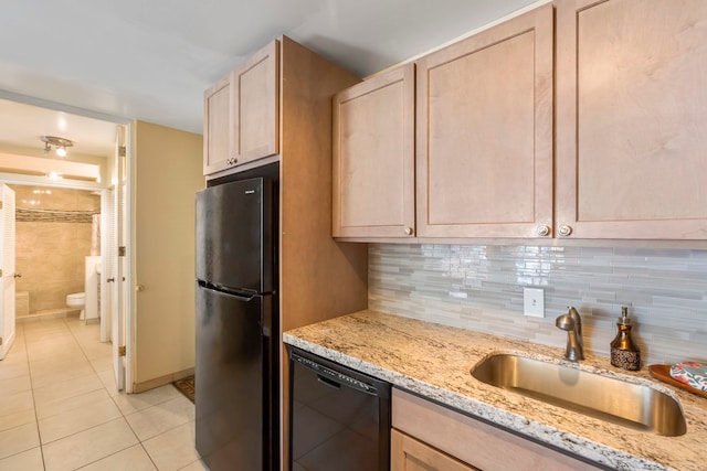 938 S Kihei Rd Unit 403, Kihei, HI 96753 - kitchen with freestanding refrigerator, black dishwasher, light brown cabinetry, light tile patterned floors, and light stone counters