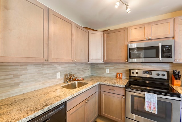 kitchen featuring appliances with stainless steel finishes, light brown cabinets, tasteful backsplash, and sink