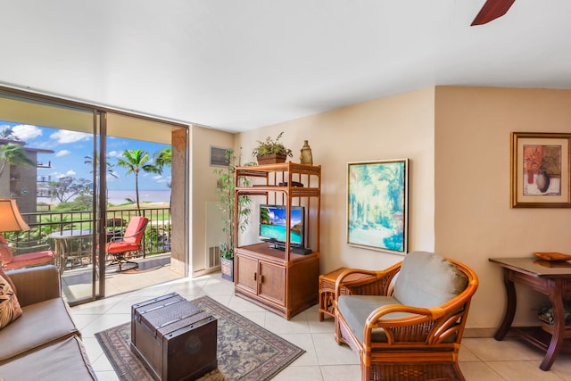 938 S Kihei Rd Unit 403, Kihei, HI 96753 - living room with light tile patterned floors and ceiling fan