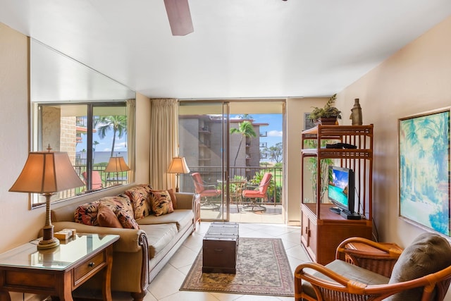 living room with ceiling fan and light tile patterned floors