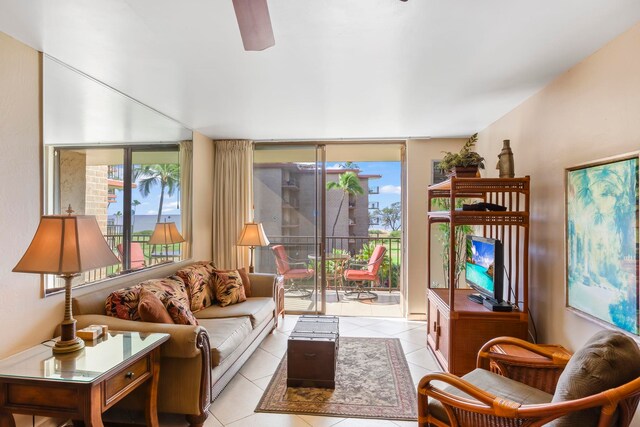 938 S Kihei Rd Unit 403, Kihei, HI 96753 - living area featuring light tile patterned flooring, ceiling fan, and expansive windows