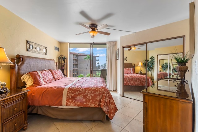 tiled bedroom with access to outside and ceiling fan