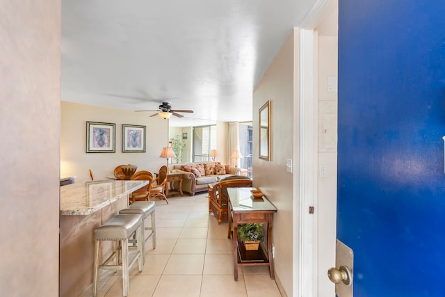 interior space featuring ceiling fan