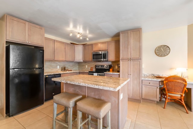 938 S Kihei Rd Unit 403, Kihei, HI 96753 - kitchen with black appliances, light tile patterned flooring, tasteful backsplash, a breakfast bar area, and a center island