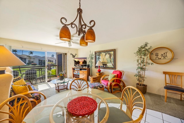 dining area featuring light tile patterned floors and ceiling fan