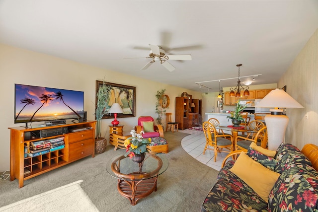 carpeted living room featuring ceiling fan