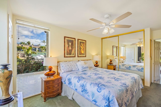 bedroom with carpet flooring, ceiling fan, and a closet