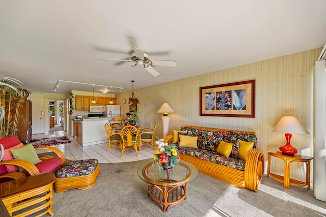 living room with light tile patterned floors, track lighting, and ceiling fan