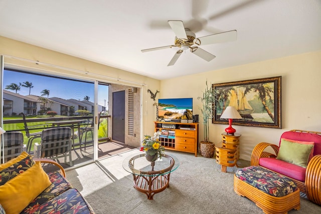 carpeted living room featuring ceiling fan