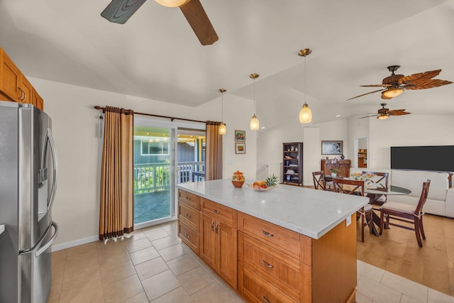 1363 Owaka St, Wailuku, HI 96793 - kitchen with stainless steel refrigerator with ice dispenser, a ceiling fan, vaulted ceiling, a center island, and hanging light fixtures