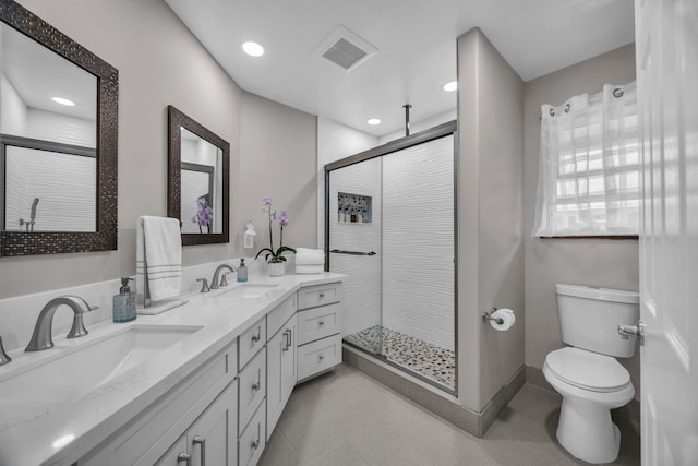 1363 Owaka St, Wailuku, HI 96793 - bathroom featuring double vanity, a shower stall, and recessed lighting