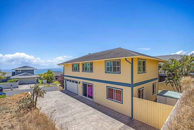 1363 Owaka St, Wailuku, HI 96793 - view of front facade with driveway and an attached garage
